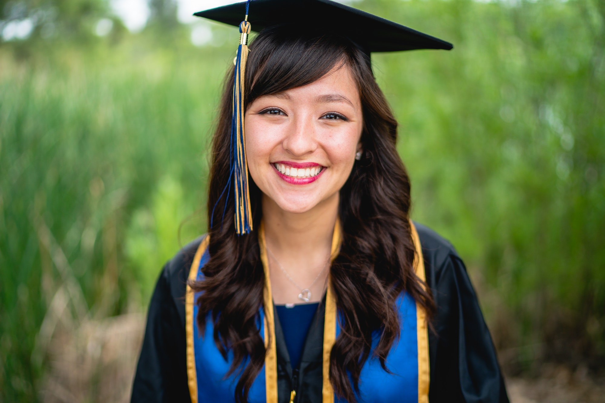 College Graduate Posing with Cap and Gown